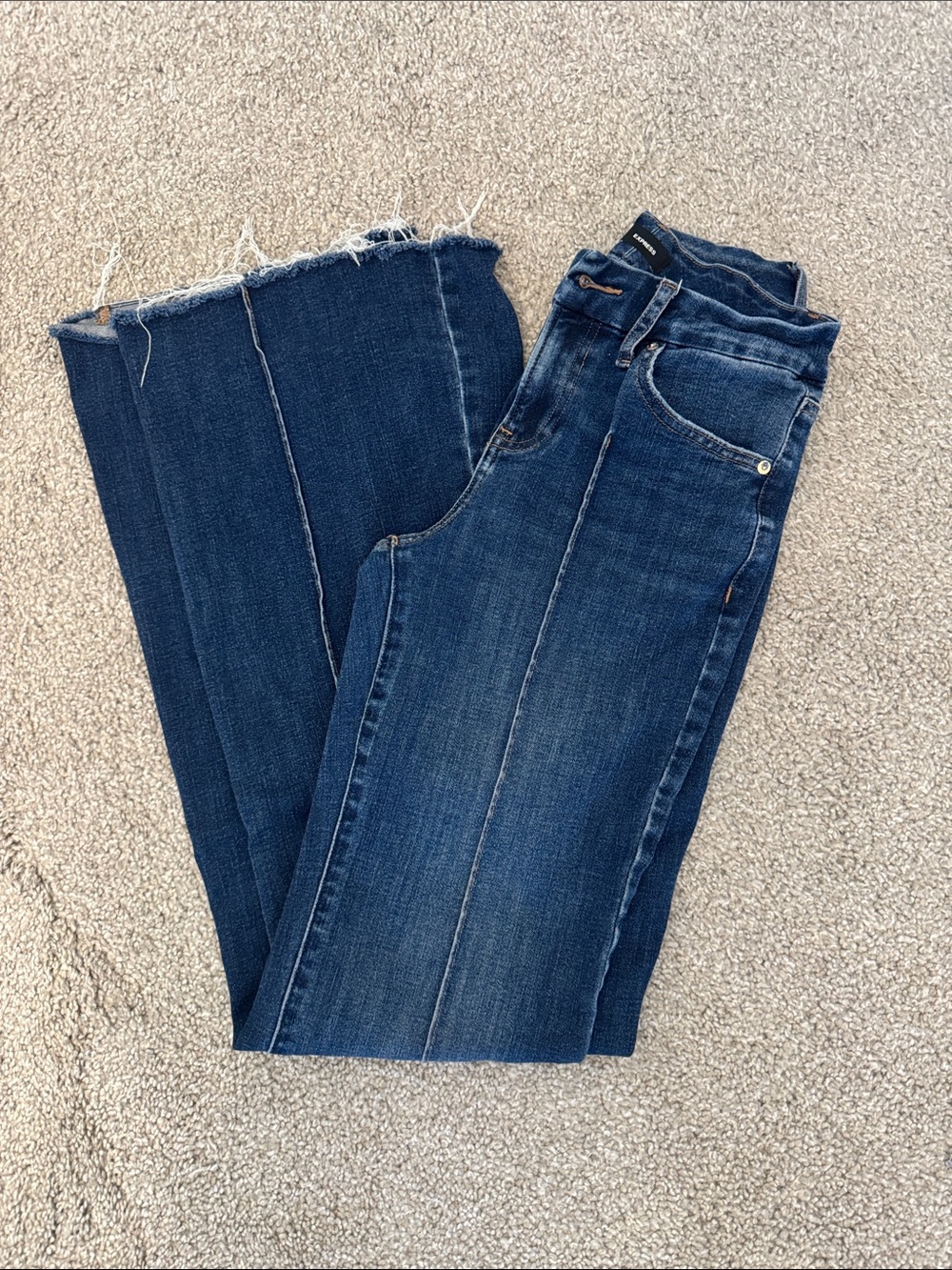 Express Women's Dark Blue Flare Jeans with Raw Hem